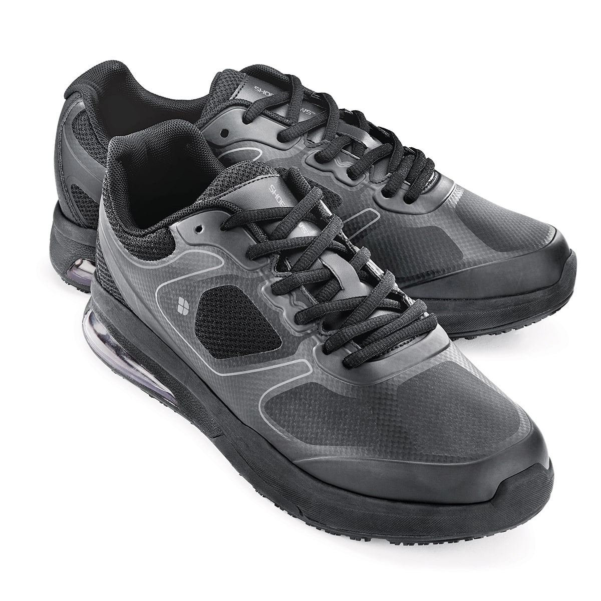 The Evolution II Black from Shoes For Crews are slip-resistant and water-resistant trainers, pair seen from the right side, emphasised on the tip of the right shoe.