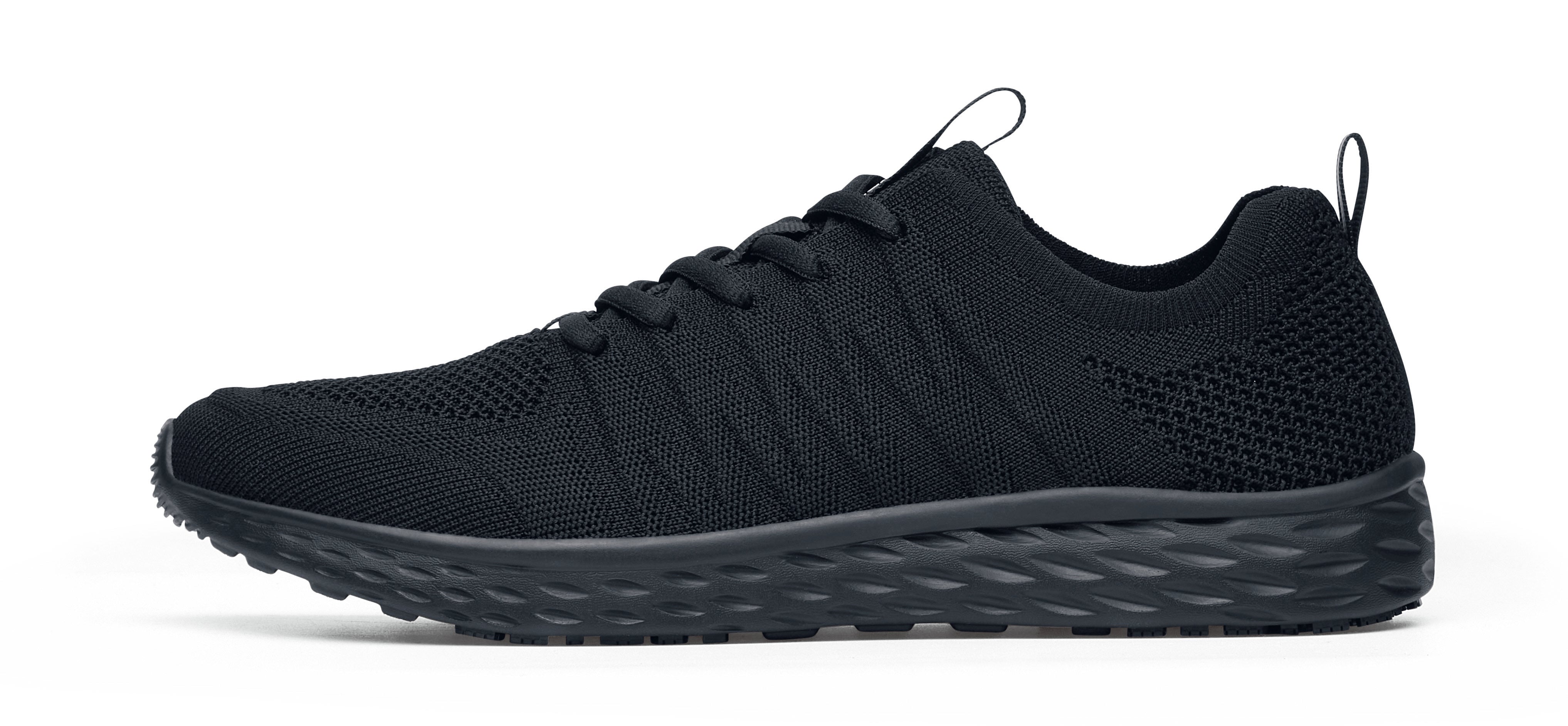 The Everlight Ce Mens Black from Shoes For Crews are slip-resistant trainers with TripGuard technology, removable cushioned insoles and are also breathable, seen from the left.